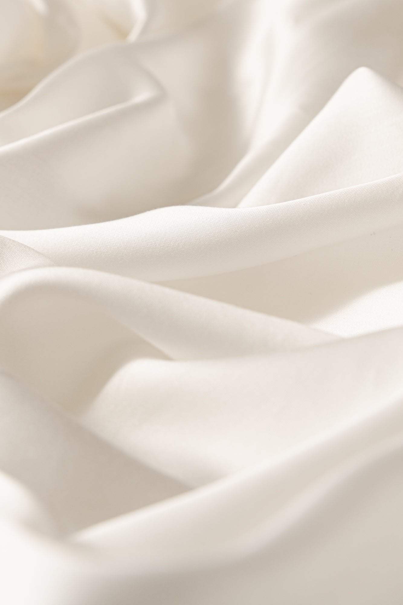 Close-up of white fabric with soft folds