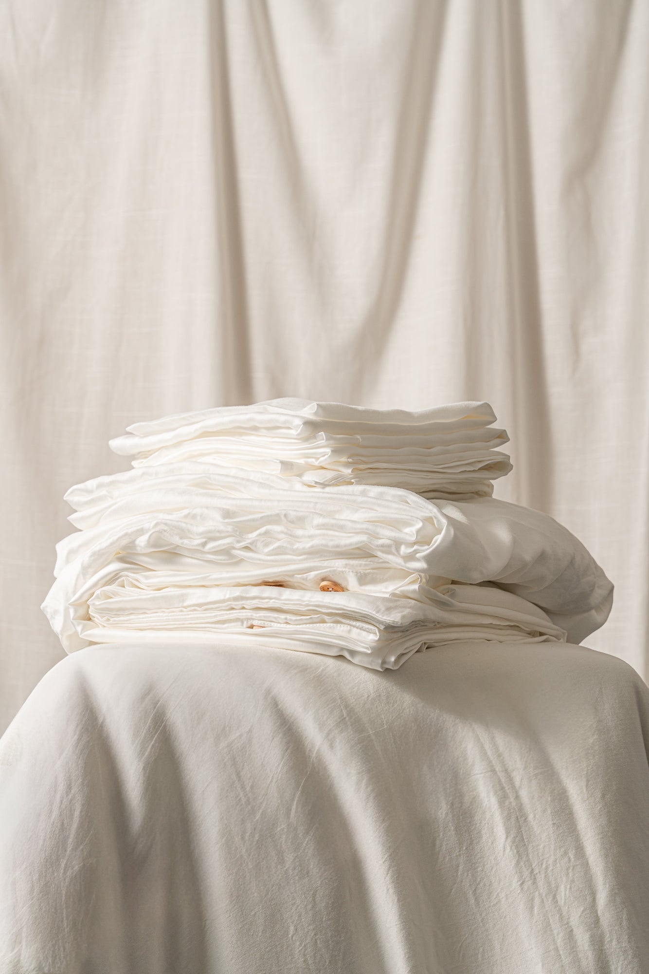 Mossva eucalyptus lyocell bedding set in natural white on a made bed